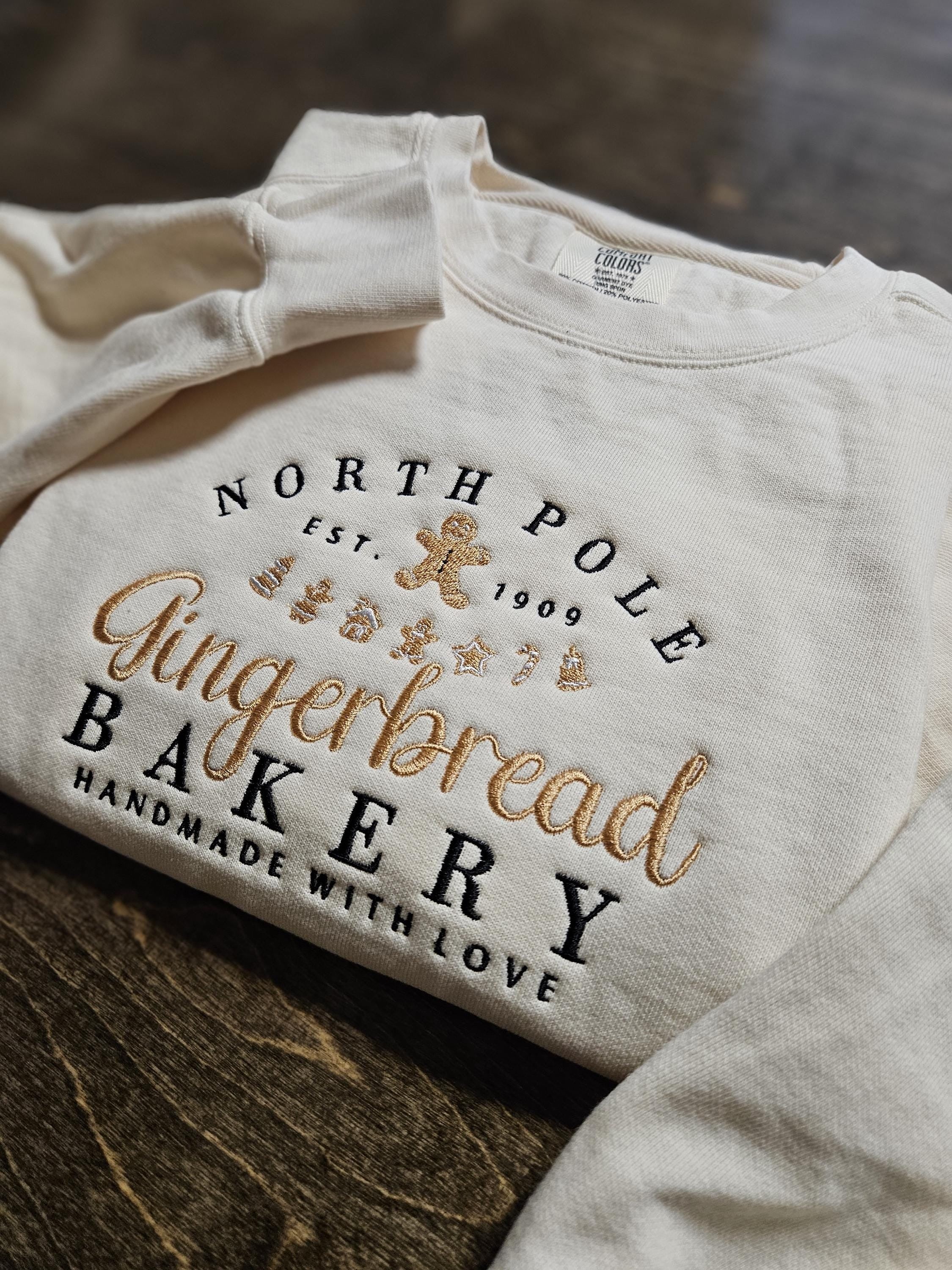 North Pole Gingerbread Bakery Embroidered Sweatshirt, Vintage Christmas Crewneck, Gingerbread Shirt, Cozy Holiday Sweater Gift EBAC53